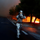 A firefighter in flame-resistant gear in Rafina.